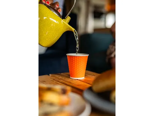 Beker porselein Les Artistes Paris 180ml met siliconen grip Oranje